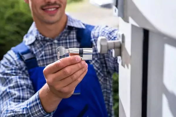 locksmith changing lock of a door for rekeying and Locksmiths cost To Rekey A Lock?