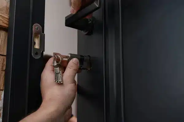 professional locksmith is rekeying a lock 